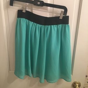 Light blue/teal mini skirt with elastic waist
